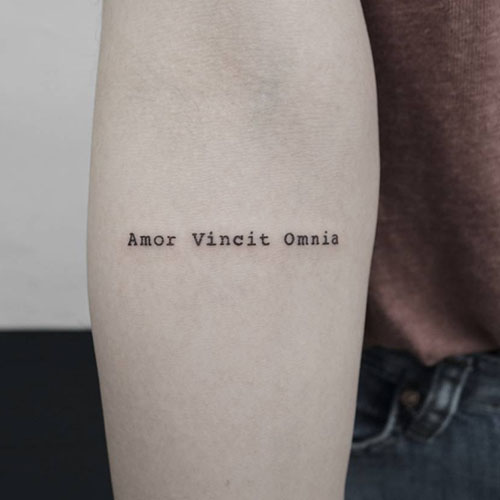 amor vincit omnia tattoo